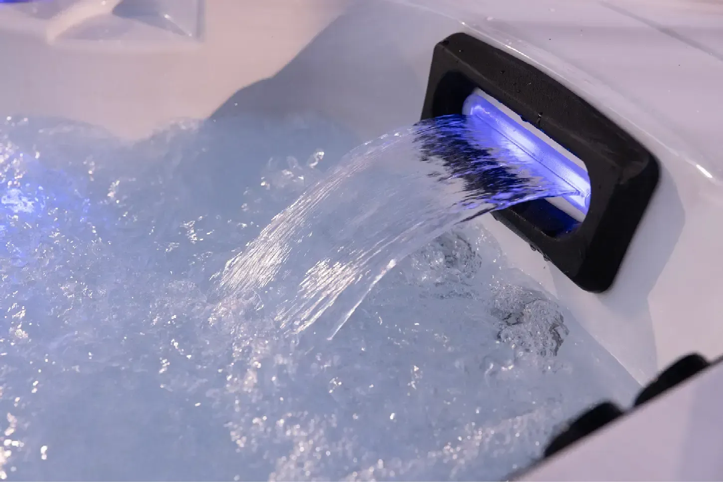 A close up of a hot tub with blue lights on it