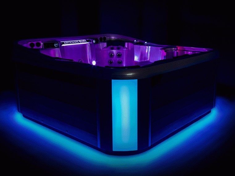 A hot tub with purple and blue lights on it