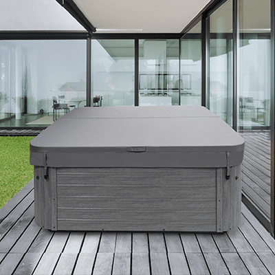 A hot tub is sitting on a wooden deck in front of a large window.