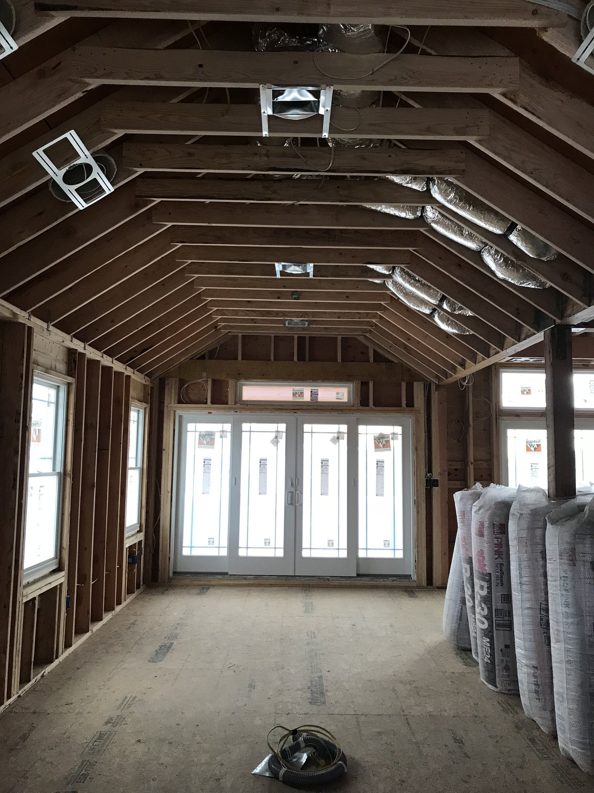 The inside of a building under construction with a lot of windows
