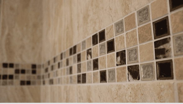 A close up of a tiled wall with squares on it