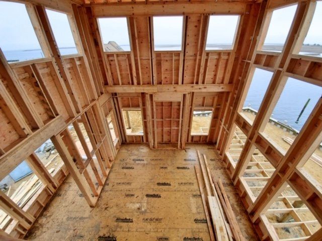 The inside of a house under construction with a view of the ocean