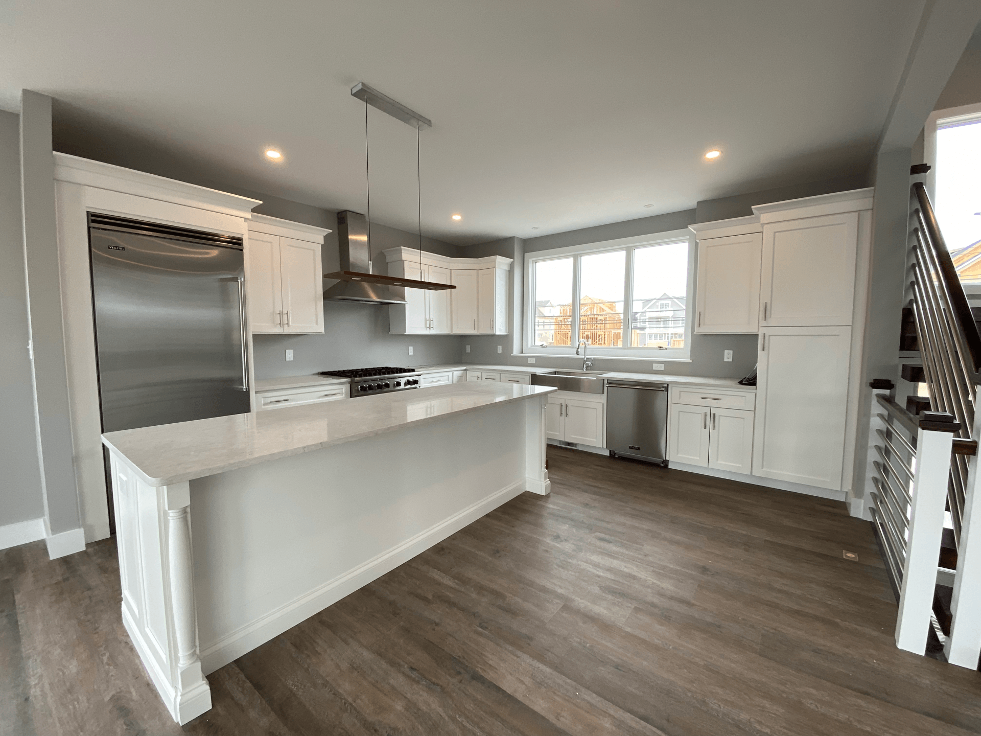There is a large island in the middle of the kitchen.