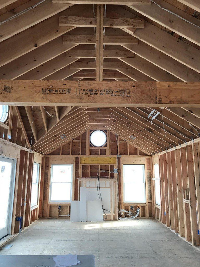 A large room with a vaulted ceiling is being built