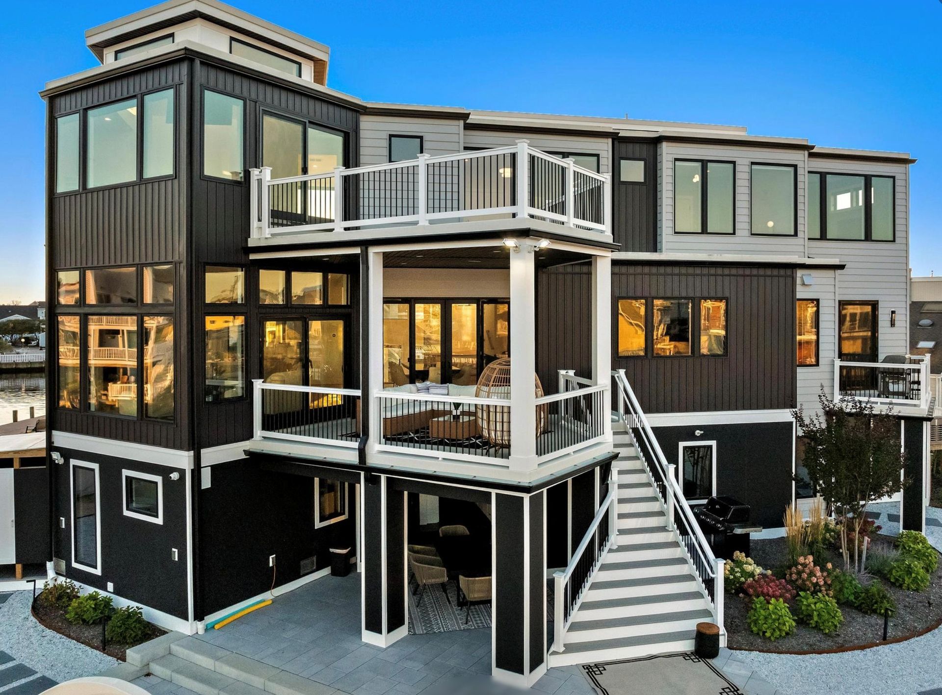 A large house with a lot of windows and stairs leading up to it.