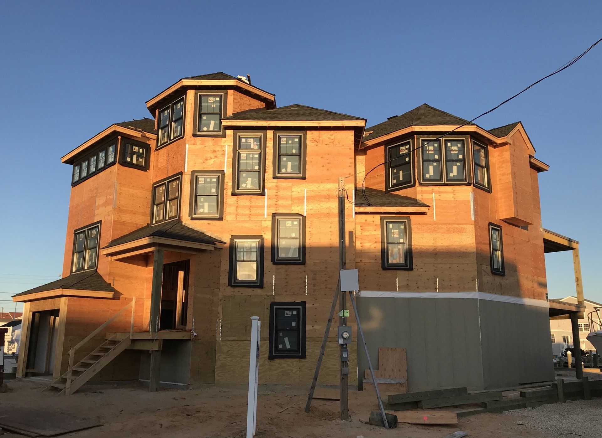 A large house is being built with a lot of windows