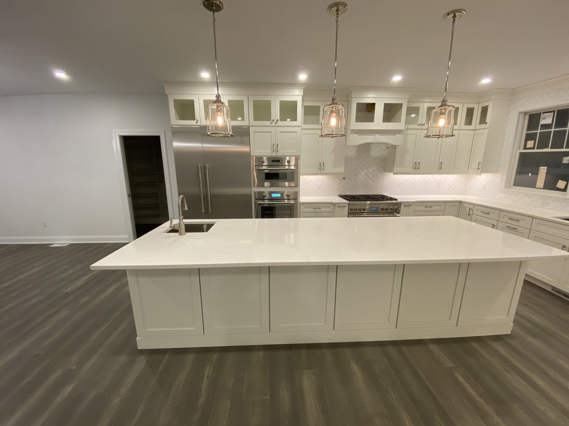 There is a large island in the middle of the kitchen.