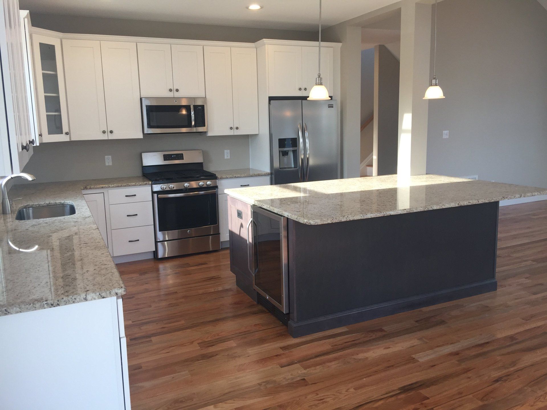 A kitchen with stainless steel appliances and granite counter tops