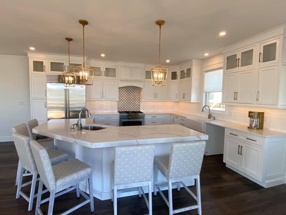 There is a large island in the middle of the kitchen.