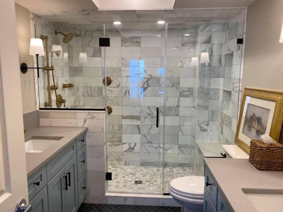 A bathroom with a walk in shower and a toilet.