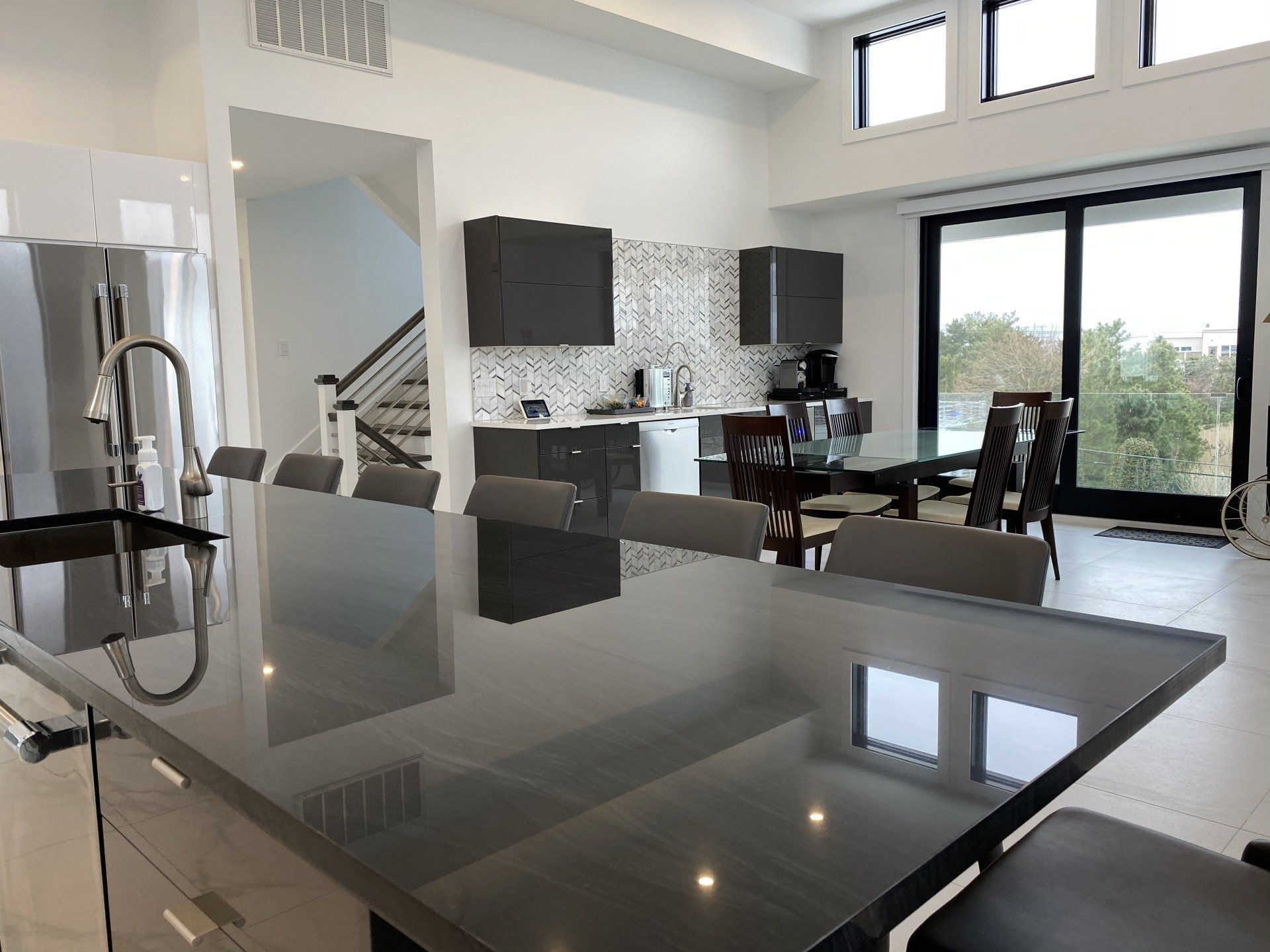A kitchen with a table and chairs in it