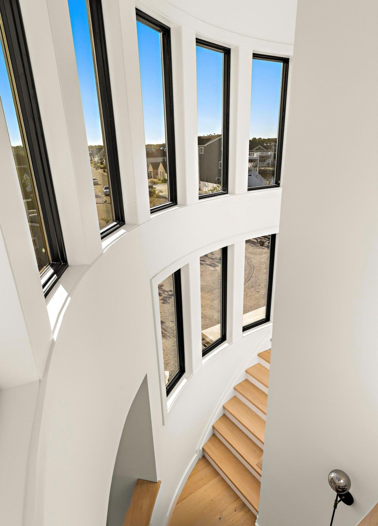 An aerial view of a spiral staircase with lots of windows.