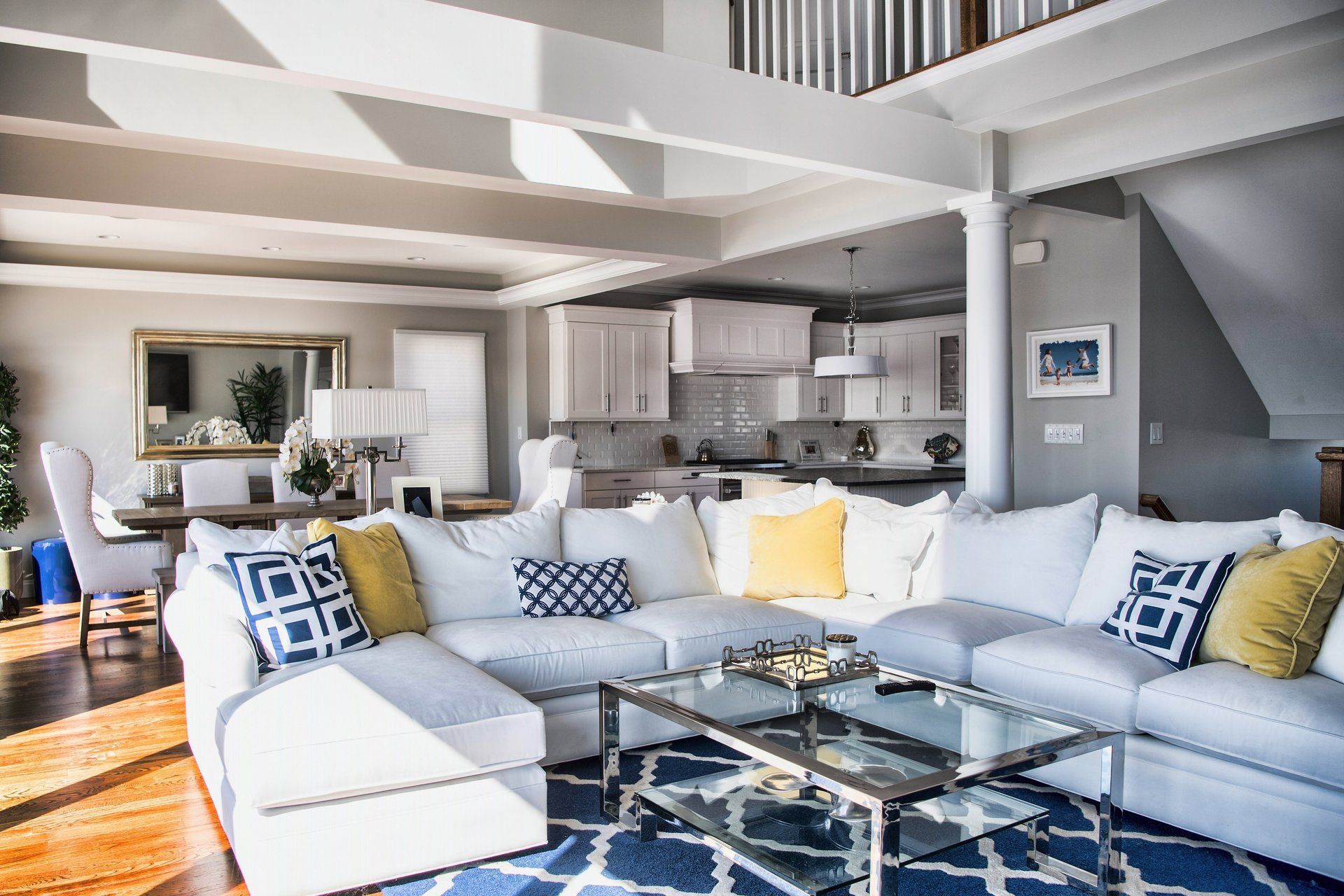 A living room with a large sectional couch and a coffee table.