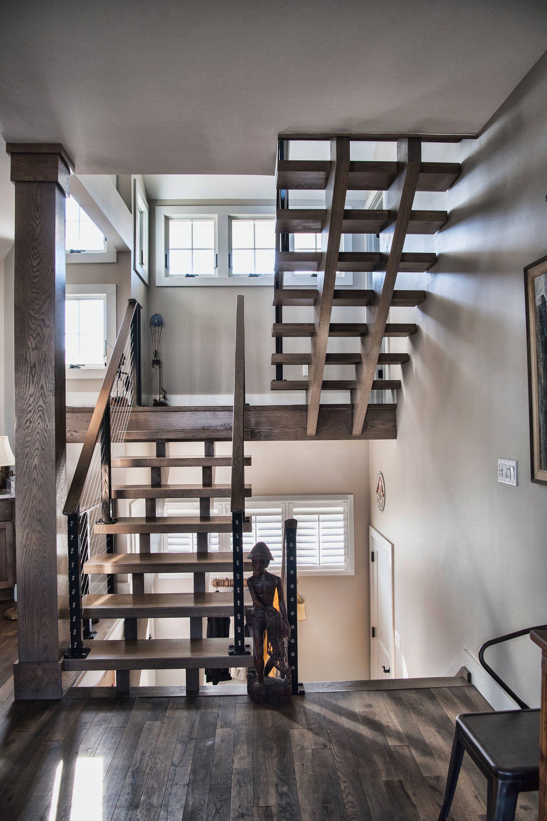 A wooden staircase leading up to the second floor of a house