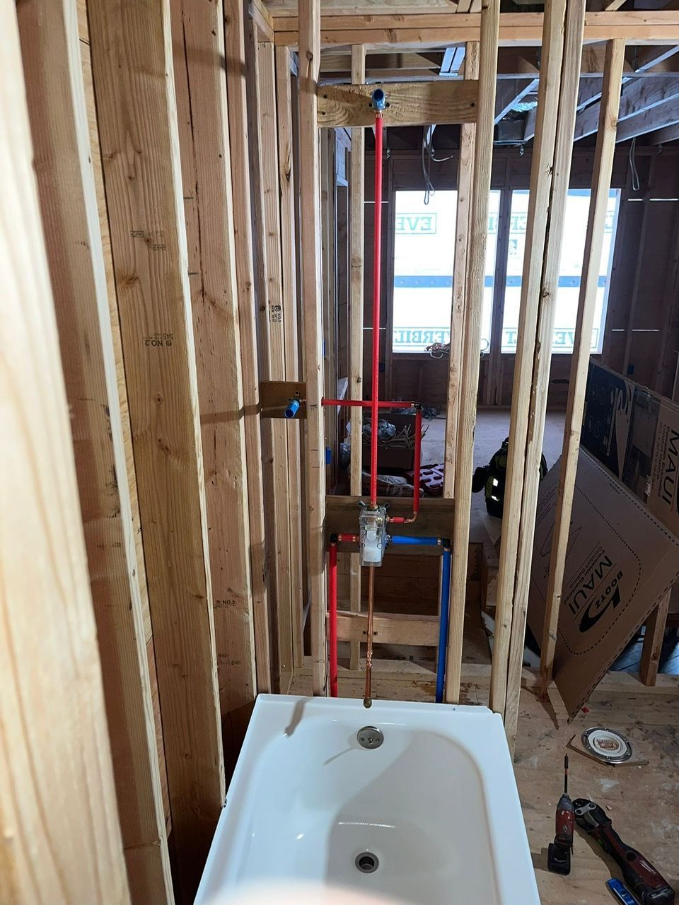 A bathtub is being installed in a bathroom