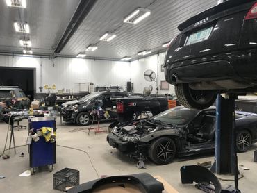 Cars in automobile repair service center