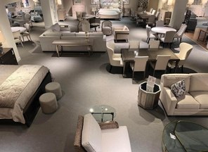 A large room filled with furniture and a bed