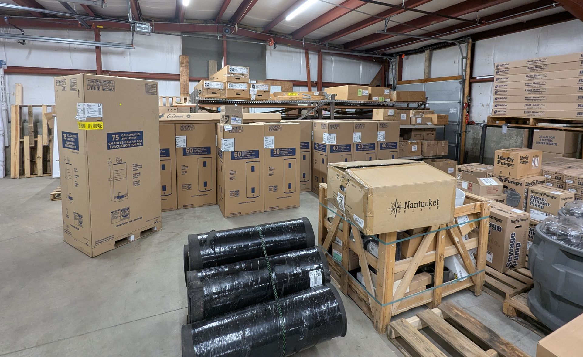 A large warehouse filled with lots of boxes and pallets.