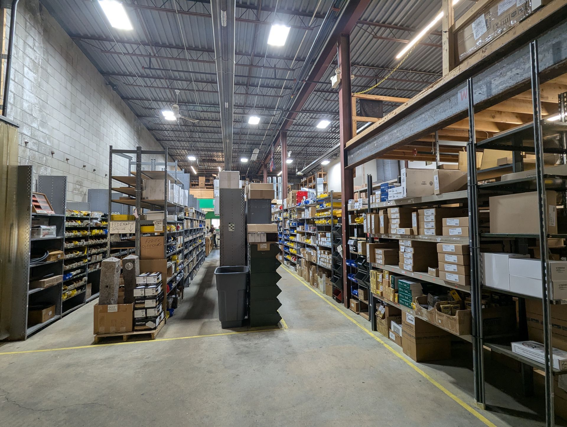 A large warehouse filled with lots of shelves and boxes