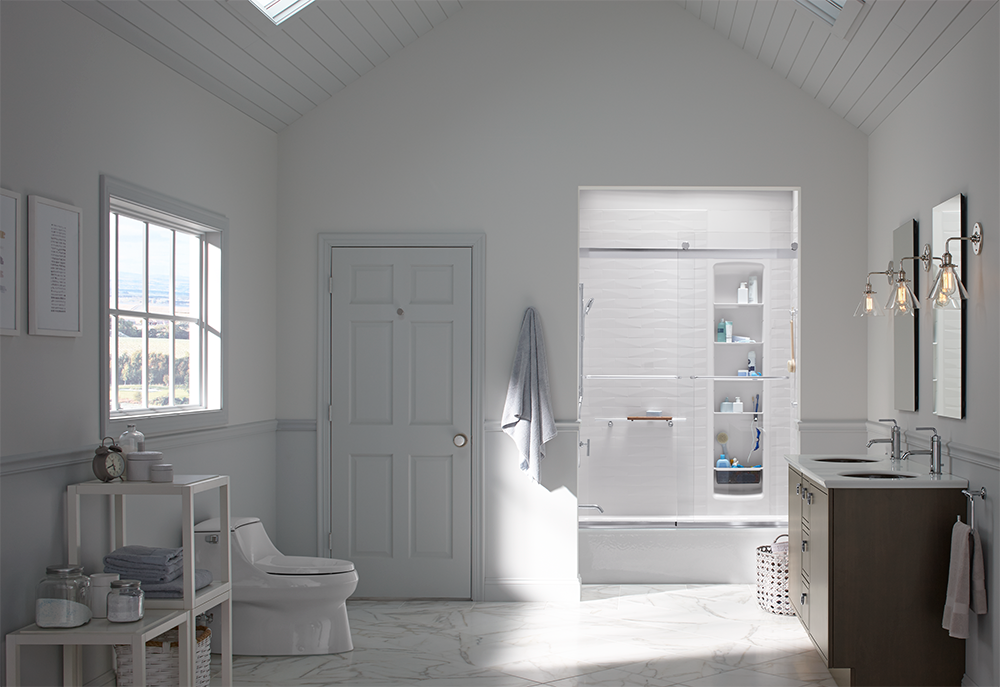 A bathroom with a toilet , sink , and bathtub.