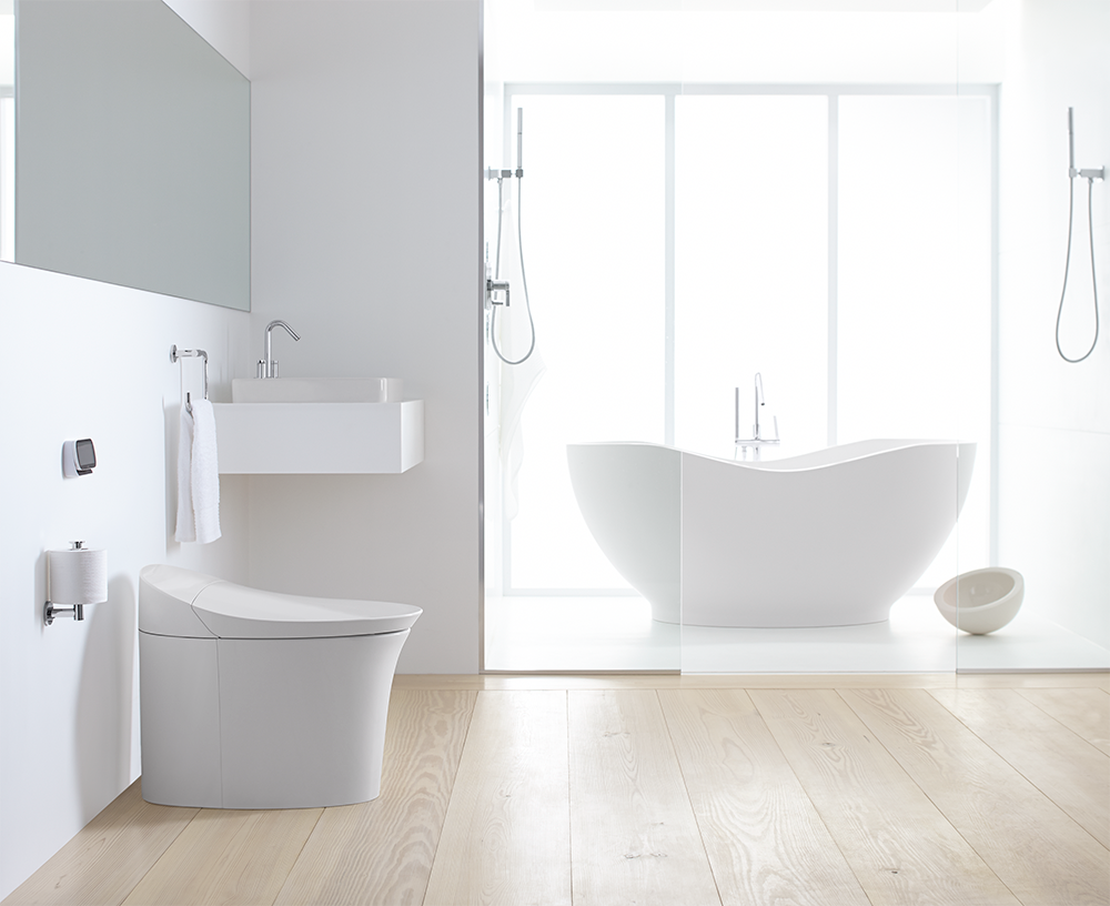 A bathroom with a toilet , sink and bathtub