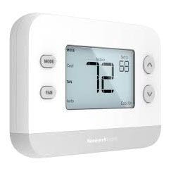 A white thermostat with a digital display and buttons on a white background.