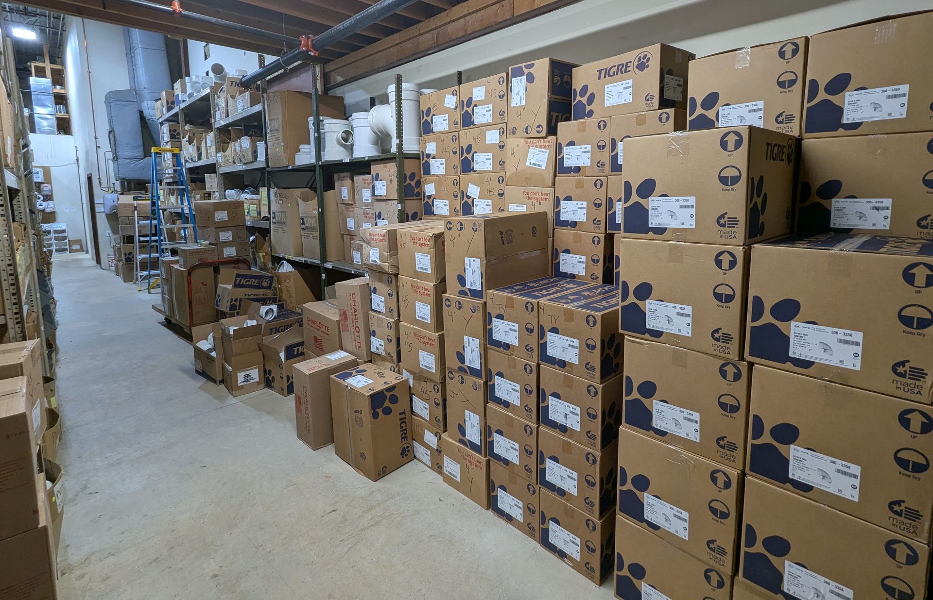 A warehouse filled with lots of boxes and shelves.