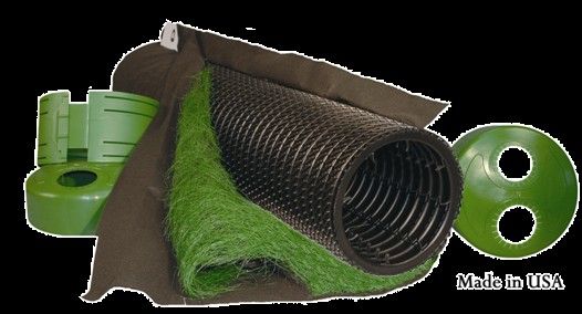 Components of a green stormwater management system: green fabric, black drainage core, green basin.