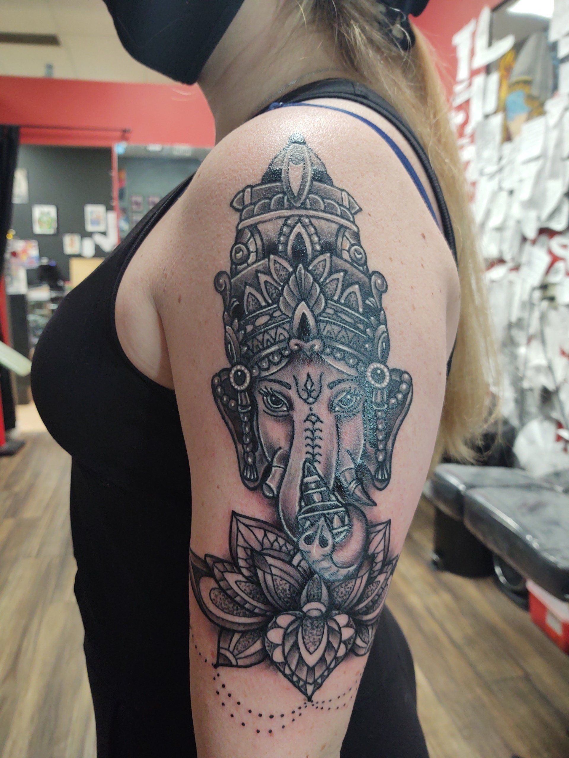 A woman has a tattoo of a elephant head on her arm