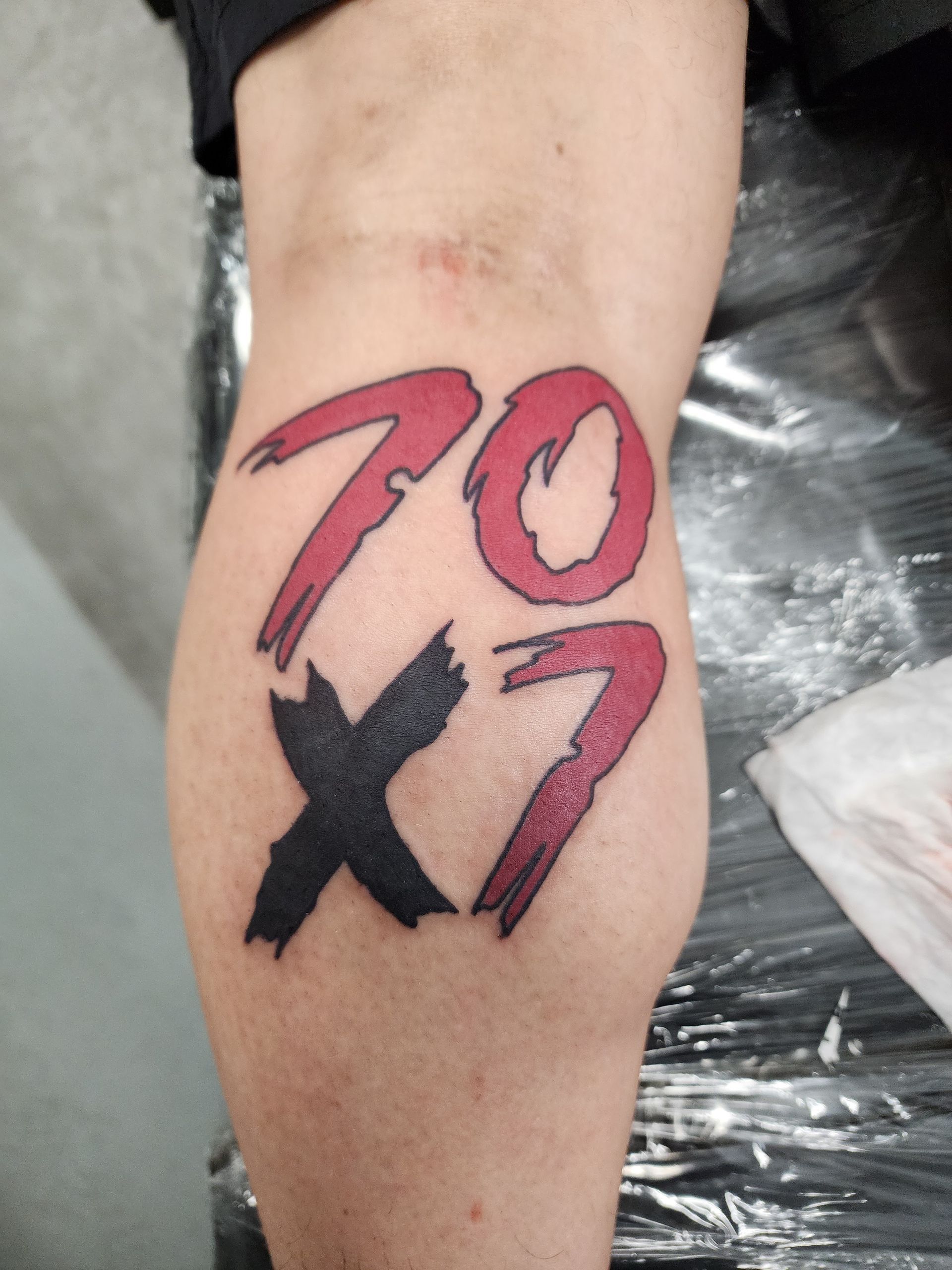 Tattoo on leg: red