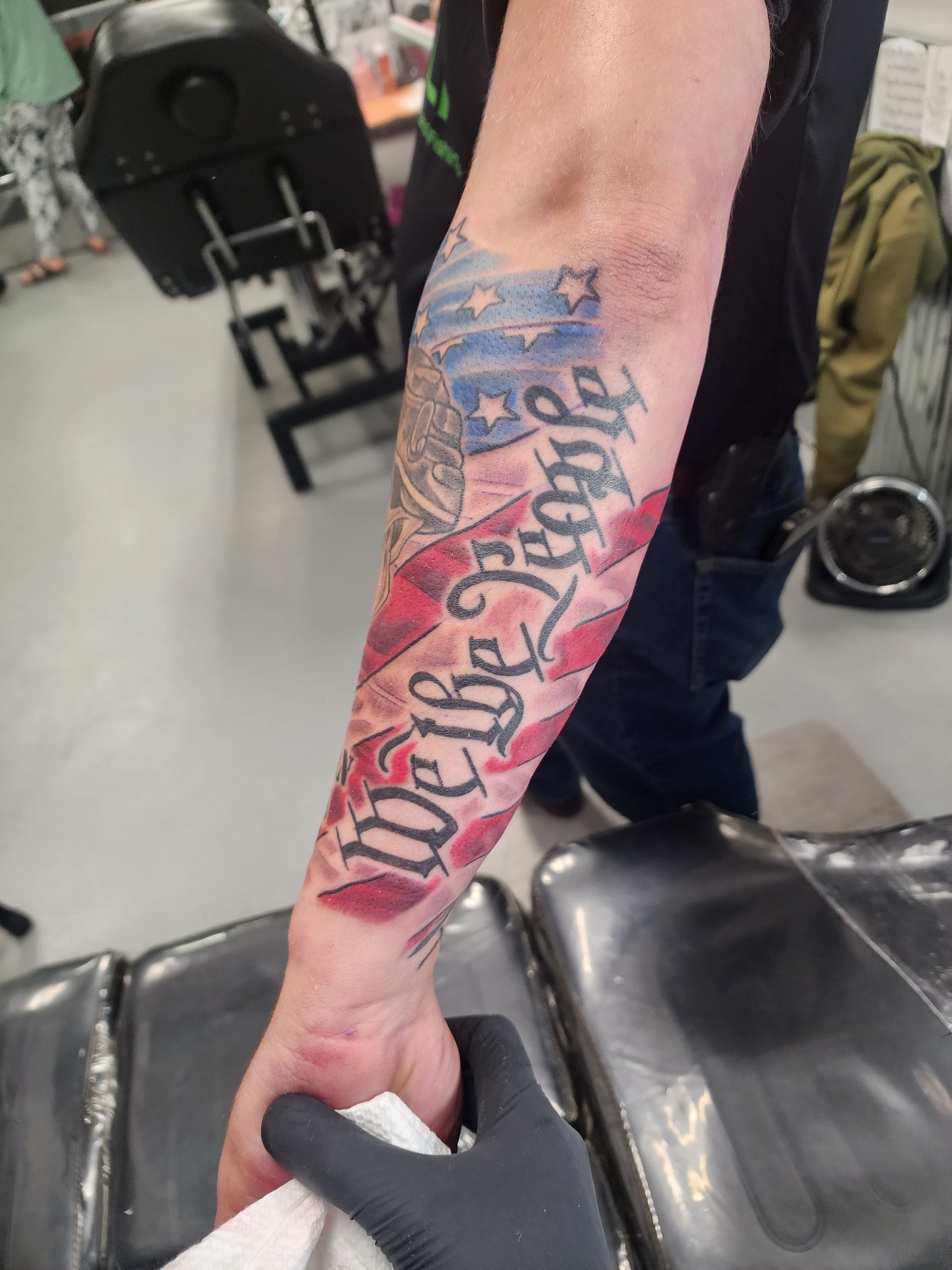 Forearm tattoo: American flag with 
