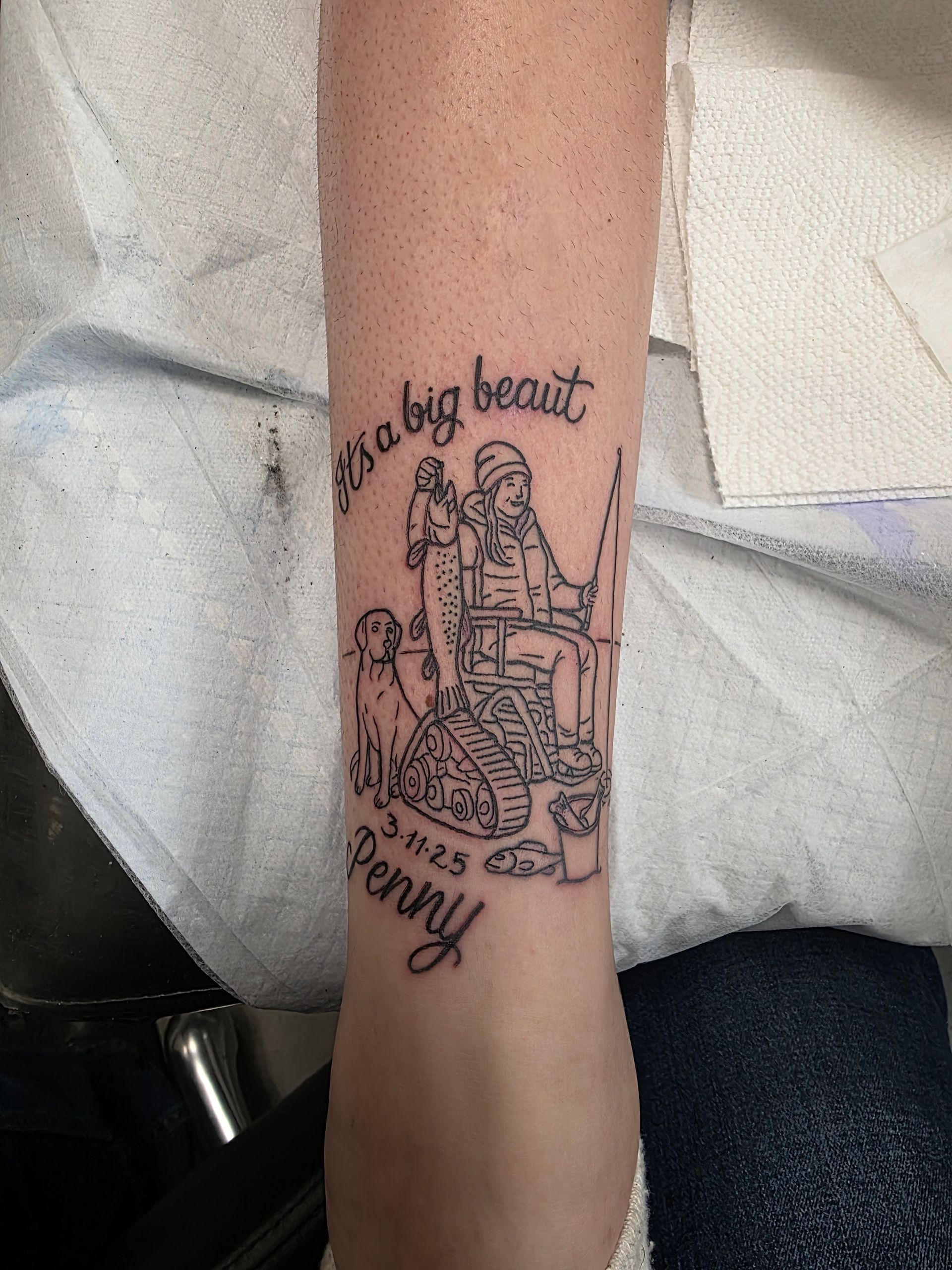 Tattoo on wrist: Person fishing with dog and text 