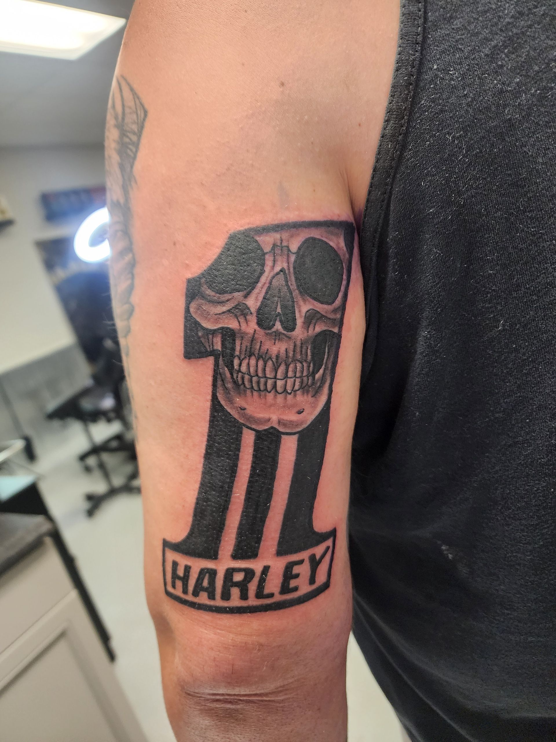 Tattoo of skull and the number 