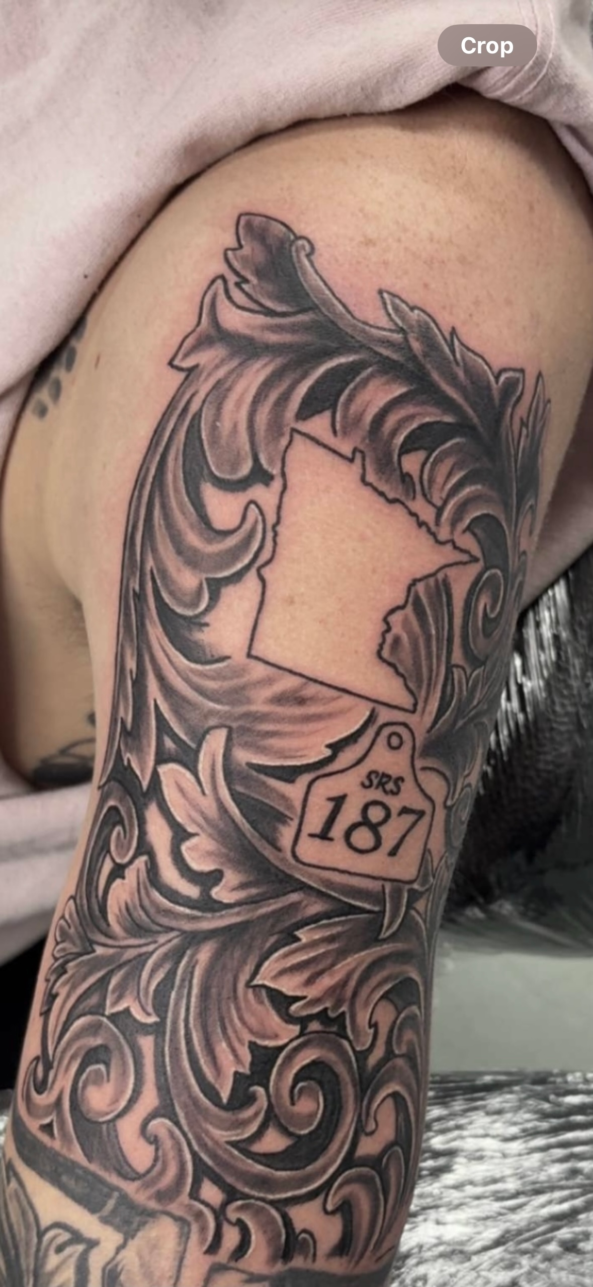 A close up of a tattoo on a person's arm.