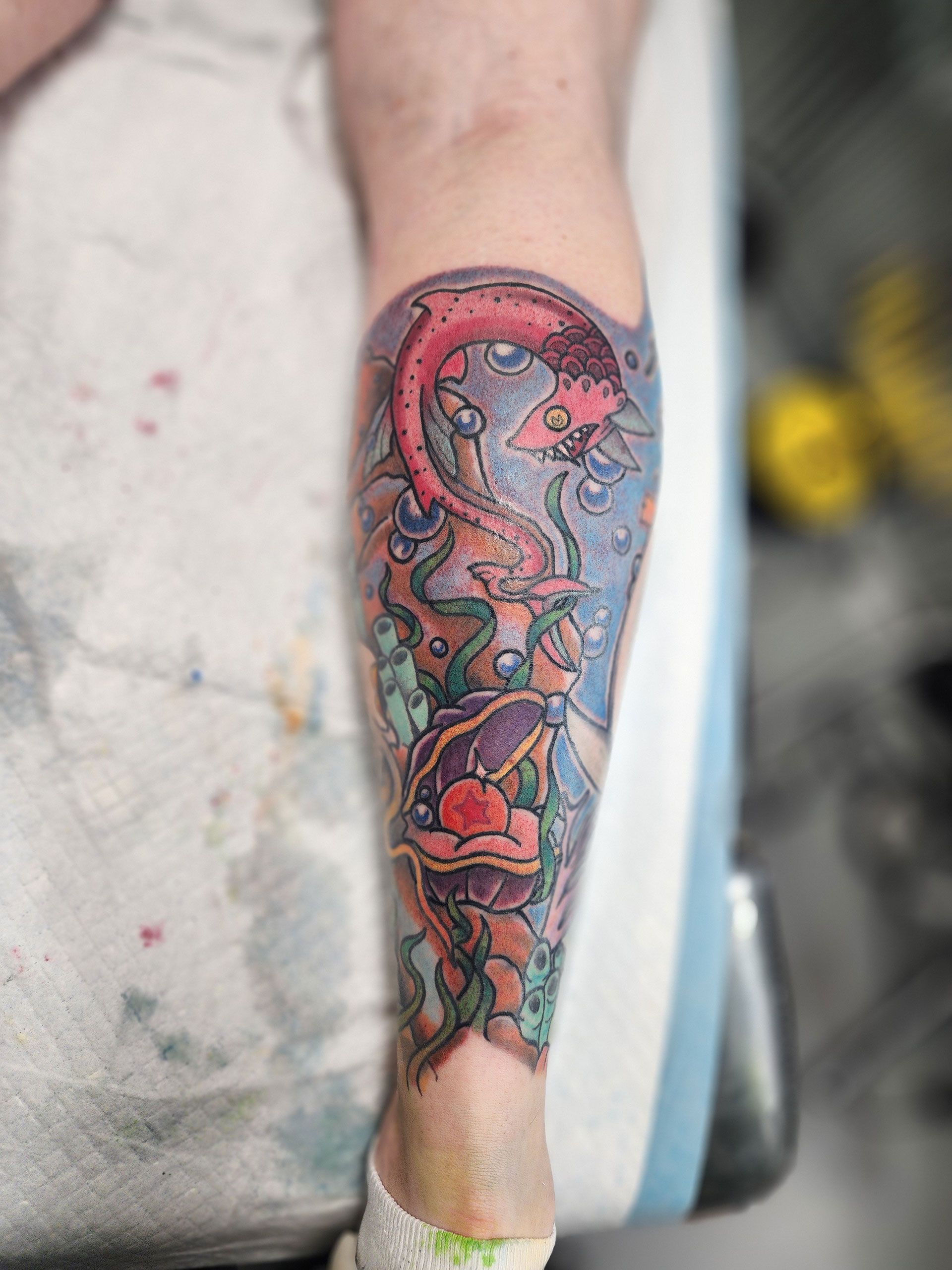 A close up of a tattoo on a person's leg