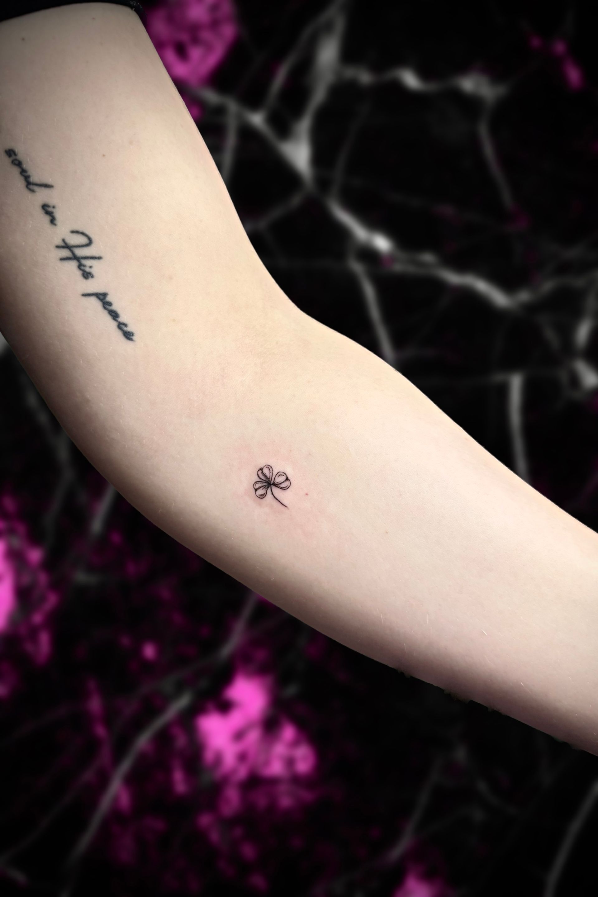 A woman has a tattoo on her arm that says  I love you