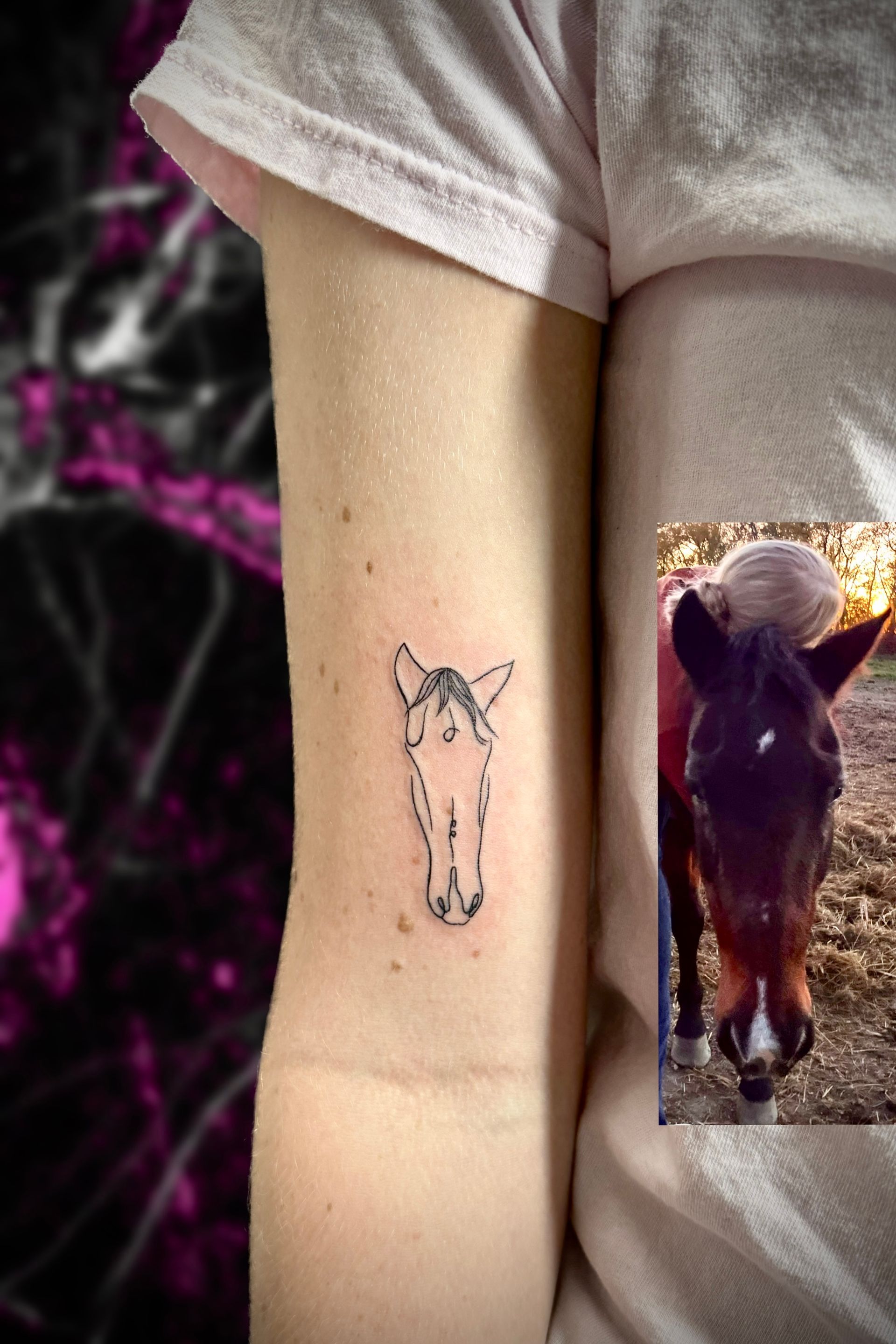 A woman has a tattoo of a horse head on her arm.