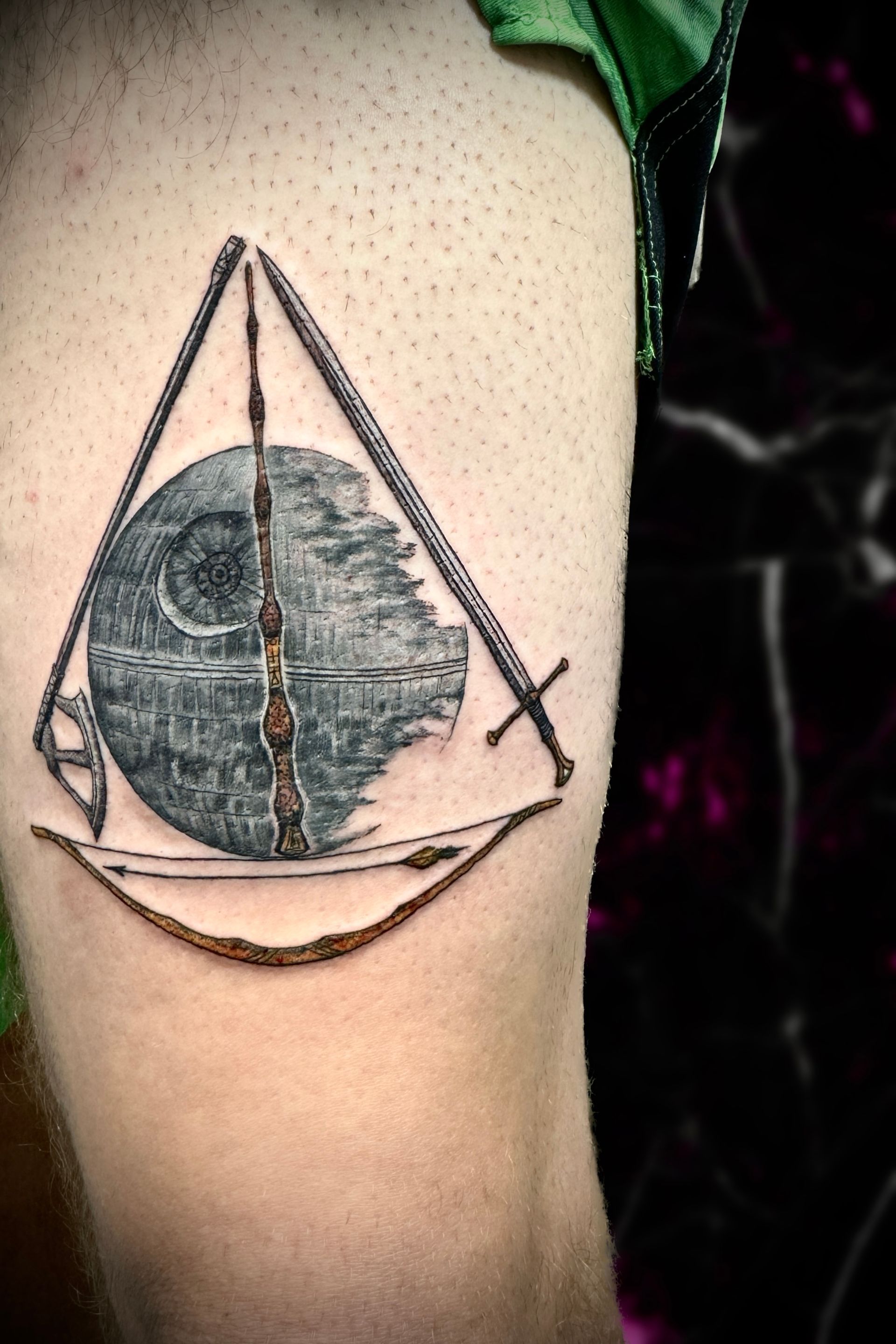 A person has a star wars tattoo on their arm.-