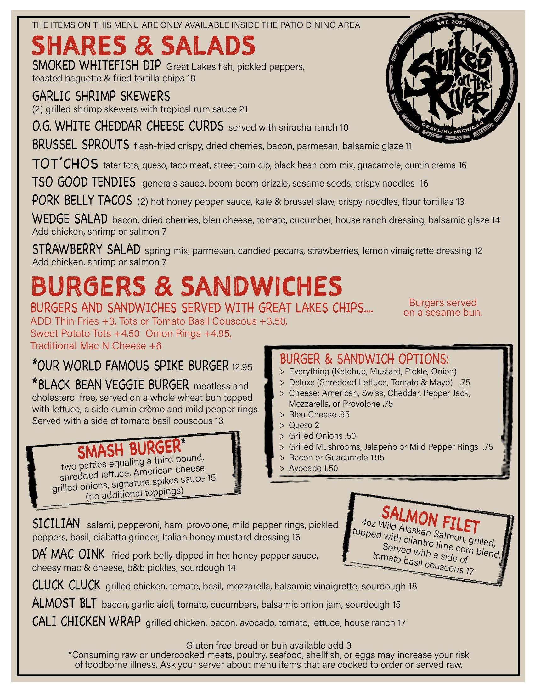 Vintage restaurant menu page with red section headers for salads, burgers, and sandwiches on a cream background.