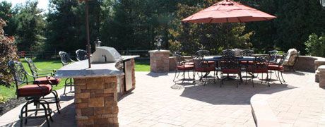 Patio area with tables, chairs, and outdoor bar