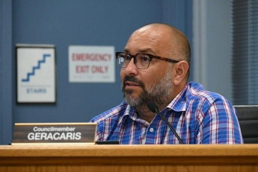 Council member Geracaris wearing eyeglass.