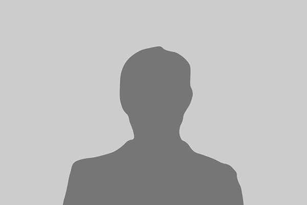 Silhouette of a person against a gray background; appears to be wearing a suit or jacket.