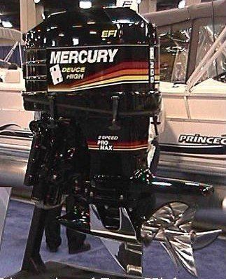 Black Mercury outboard motor with a stainless steel propeller, displayed at a boat show.