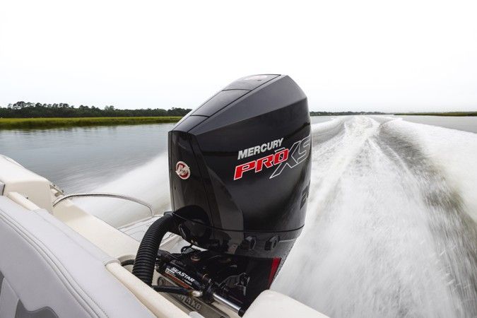 Mercury Pro XS outboard motor in motion, creating water spray.
