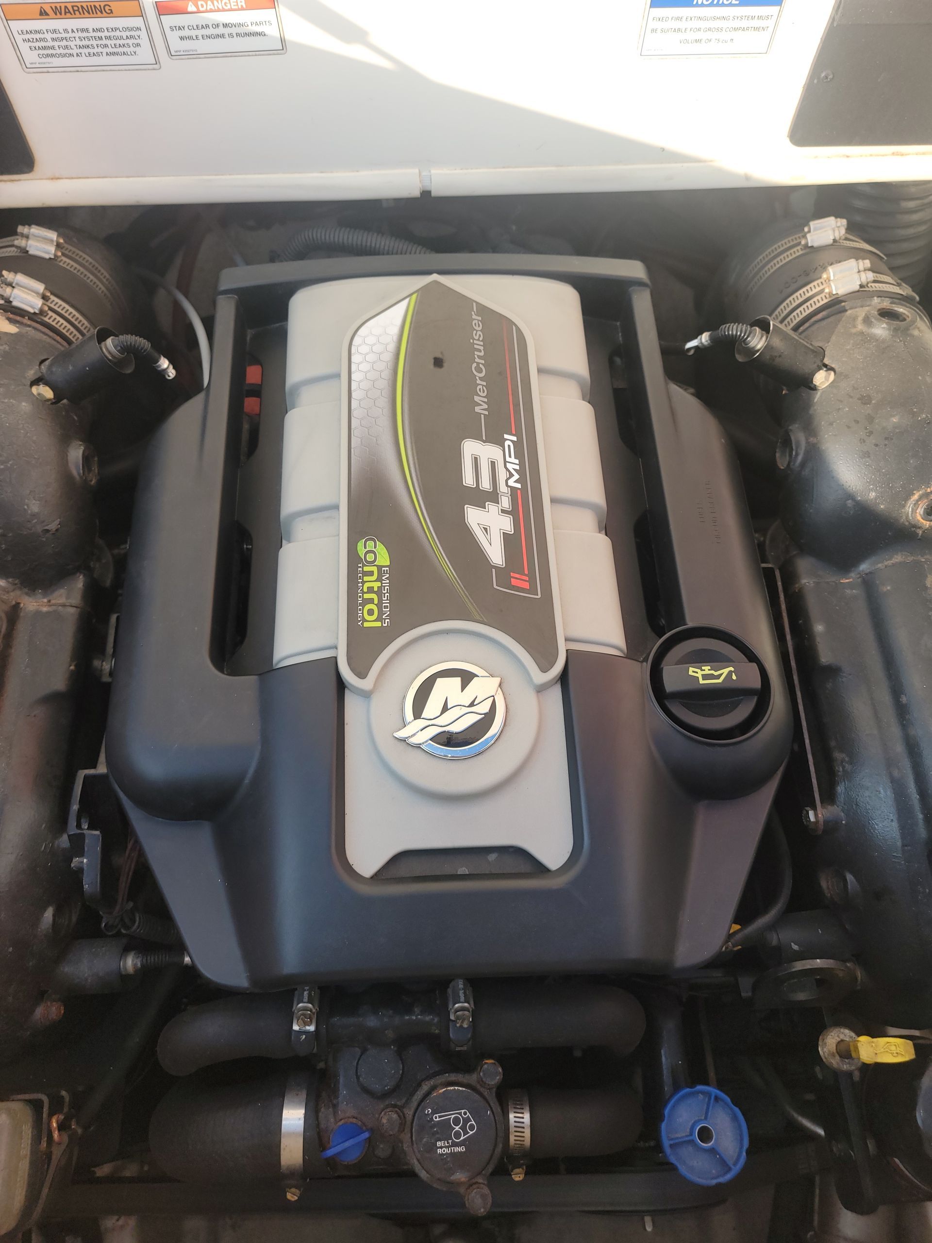 Boat engine, black and gray with Mercury logo.