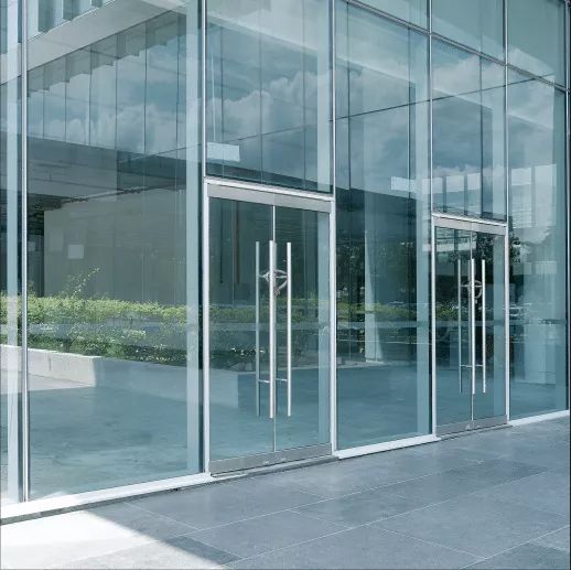 A building with a lot of glass doors and windows