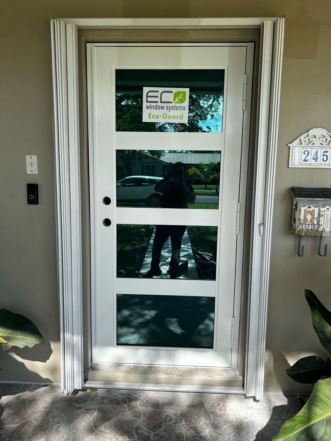 A white door with a sign on it that says eco solutions