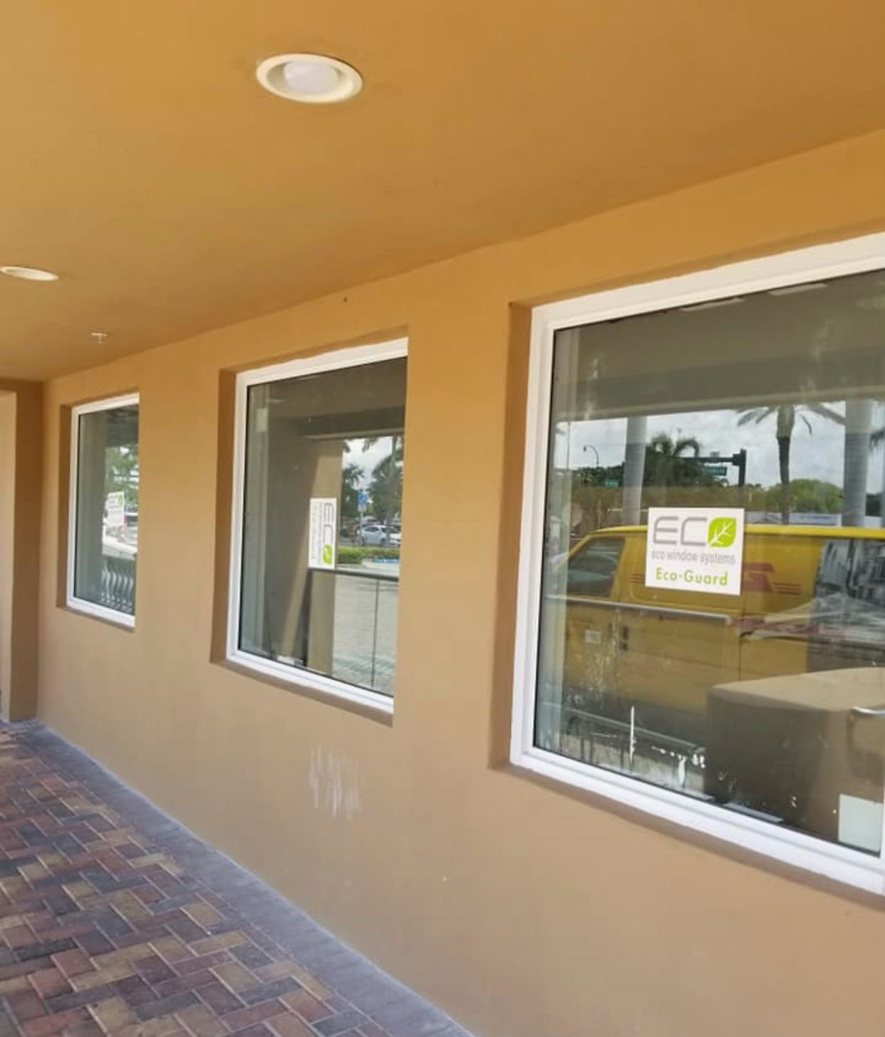 A building with a lot of windows and a sign that says eco