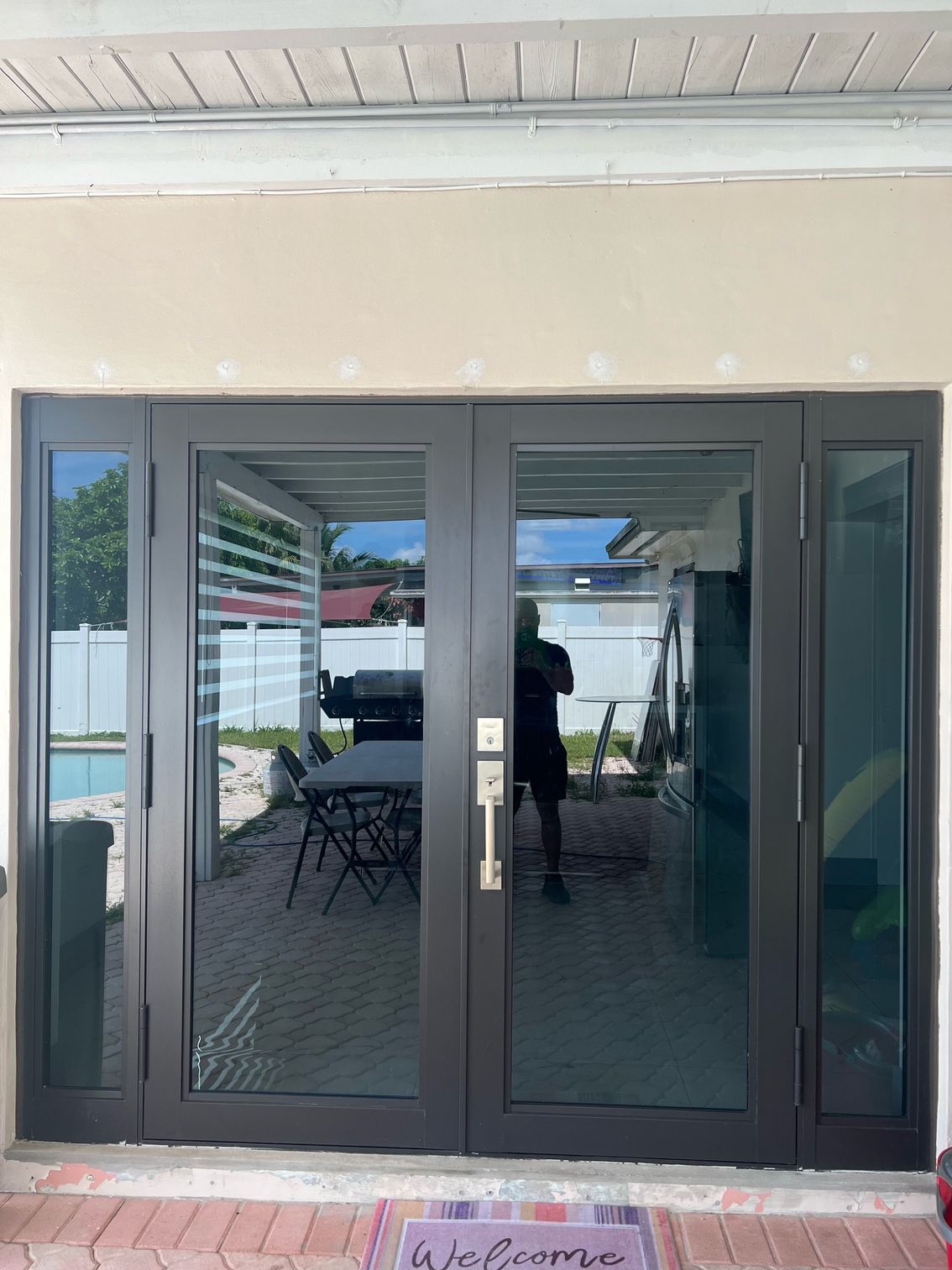 A pair of sliding glass doors leading to a patio.