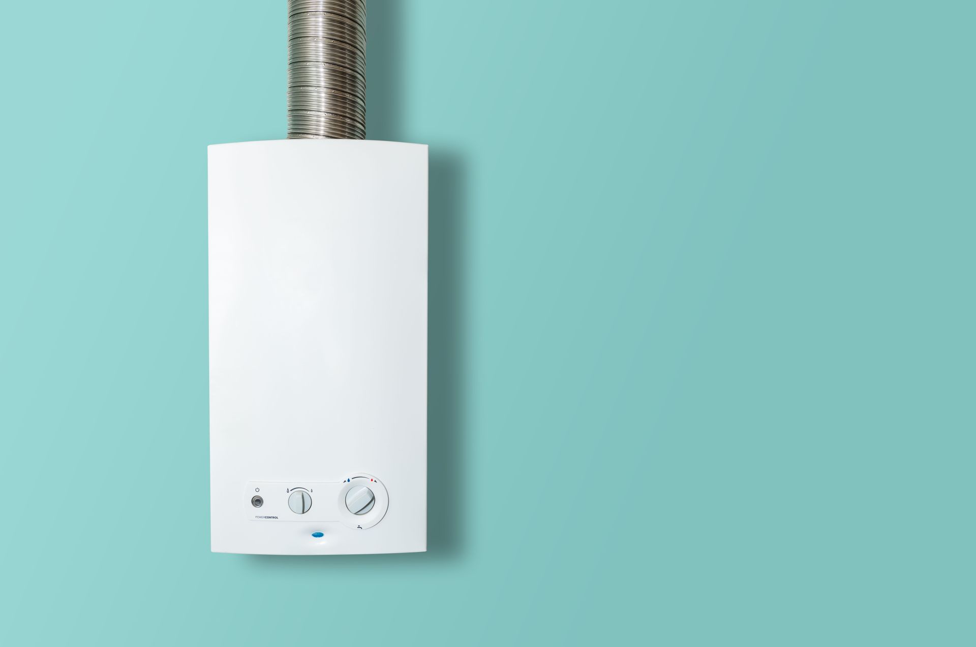 White wall-mounted boiler with a metal vent pipe on a teal background